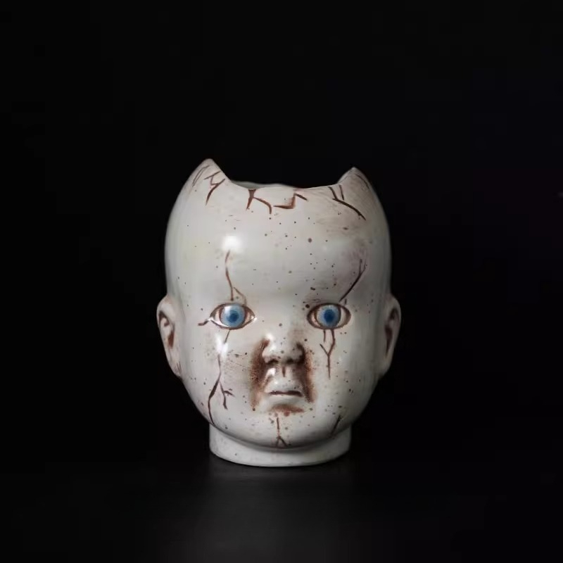 Tablet Reading Accessories - Horror themed doll head ceramic vase